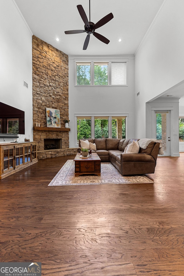 150 Dean Dr, Tyrone, GA 30290 - living room with a fireplace, a ceiling fan, a high ceiling, crown molding, and wood finished floors