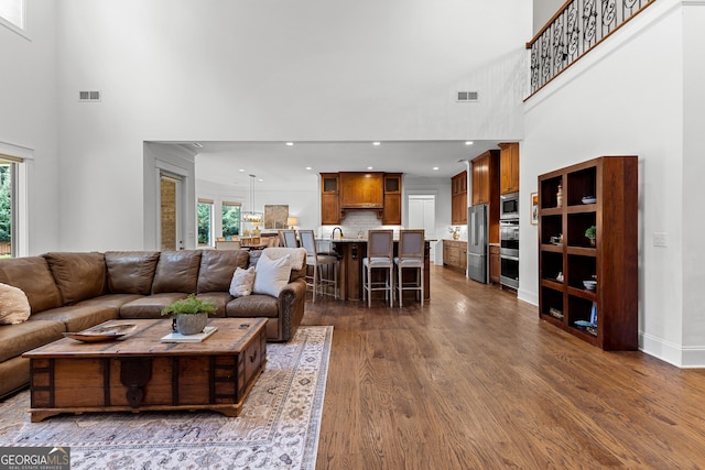 150 Dean Dr, Tyrone, GA 30290 - living room featuring a high ceiling, dark wood finished floors, and recessed lighting