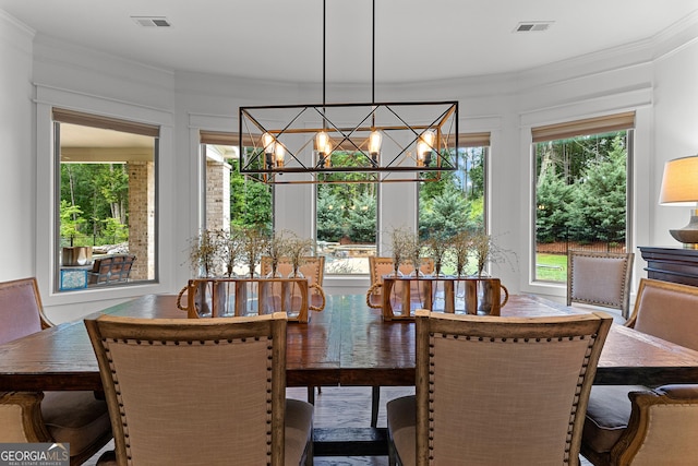 150 Dean Dr, Tyrone, GA 30290 - dining area featuring a chandelier and ornamental molding