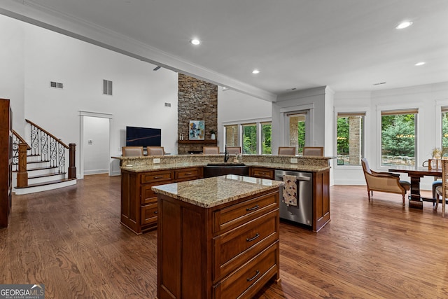 150 Dean Dr, Tyrone, GA 30290 - kitchen featuring dishwasher, a center island, crown molding, open floor plan, and dark wood-type flooring