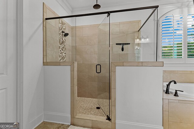 150 Dean Dr, Tyrone, GA 30290 - bathroom with a bath, a stall shower, and ornamental molding