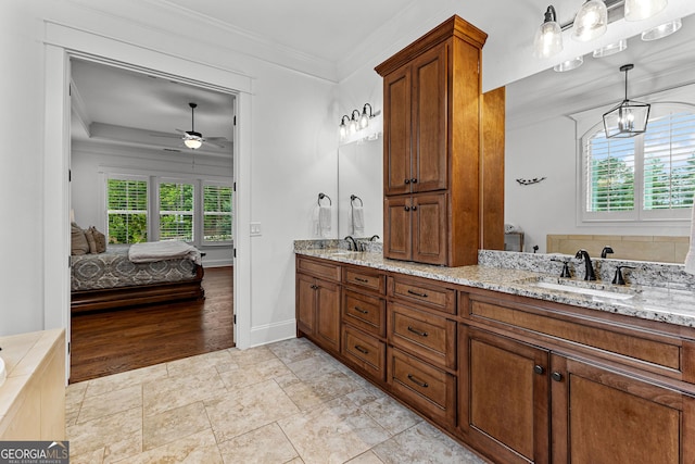 150 Dean Dr, Tyrone, GA 30290 - ensuite bathroom featuring a ceiling fan, double vanity, ornamental molding, and a chandelier