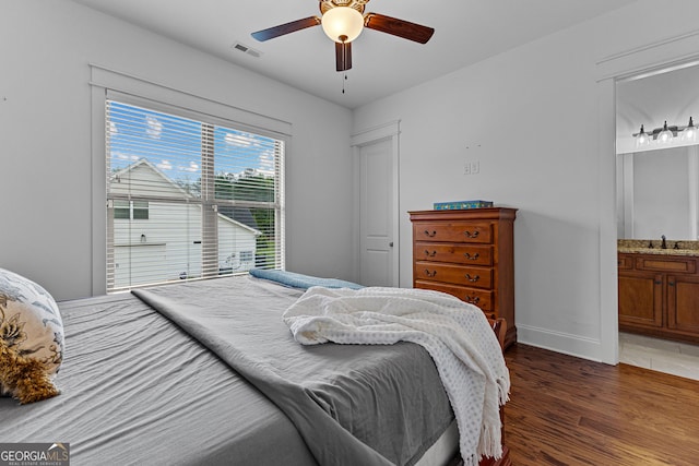 150 Dean Dr, Tyrone, GA 30290 - bedroom featuring wood finished floors, a ceiling fan, and connected bathroom