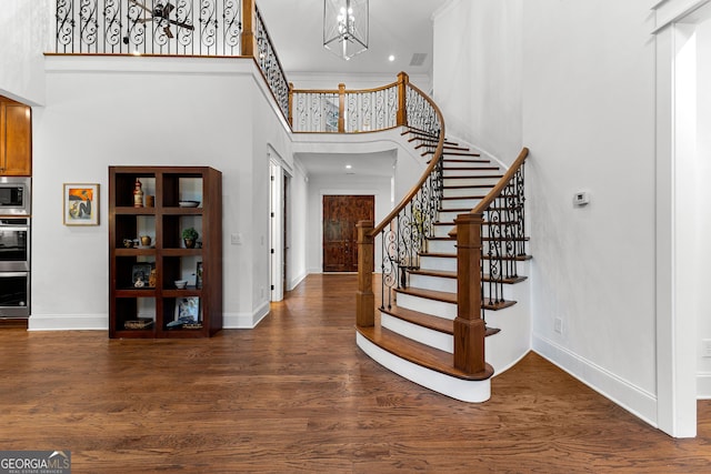 150 Dean Dr, Tyrone, GA 30290 - entryway with a towering ceiling, stairway, wood finished floors, a chandelier, and recessed lighting