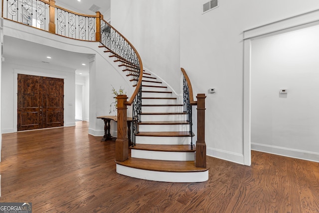150 Dean Dr, Tyrone, GA 30290 - entrance foyer featuring wood finished floors, a high ceiling, stairway, and recessed lighting