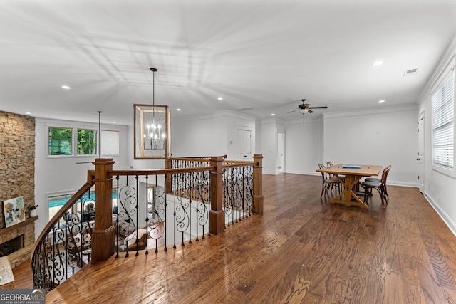 150 Dean Dr, Tyrone, GA 30290 - hall with an upstairs landing, recessed lighting, wood finished floors, a chandelier, and crown molding