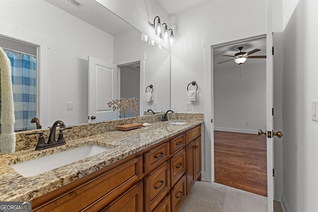150 Dean Dr, Tyrone, GA 30290 - bathroom featuring ceiling fan, double vanity, and tile patterned floors