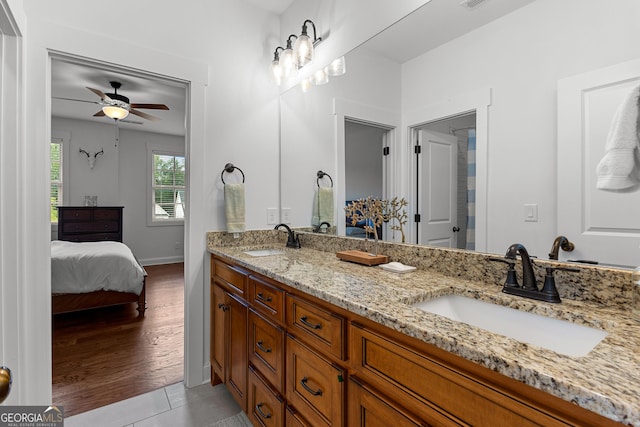 150 Dean Dr, Tyrone, GA 30290 - ensuite bathroom featuring double vanity, a ceiling fan, and wood finished floors