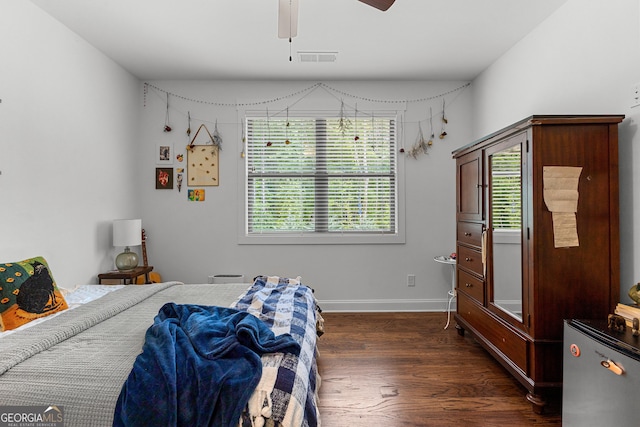 150 Dean Dr, Tyrone, GA 30290 - bedroom with dark wood-type flooring, refrigerator, and ceiling fan