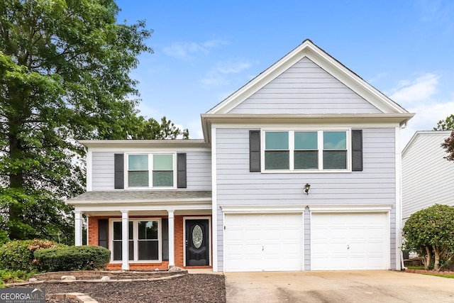 2801 Priestcliff Dr, Smyrna, GA 30080 - traditional home with concrete driveway, a garage, brick siding, and covered porch