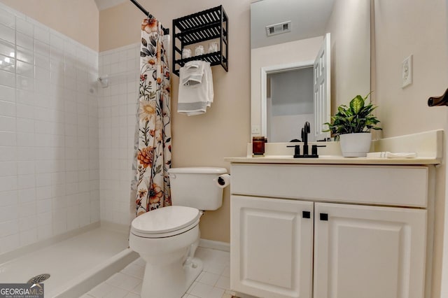 1635 Lake Heights Cir, Dacula, GA 30019 - bathroom featuring vanity, tiled shower, and tile patterned floors