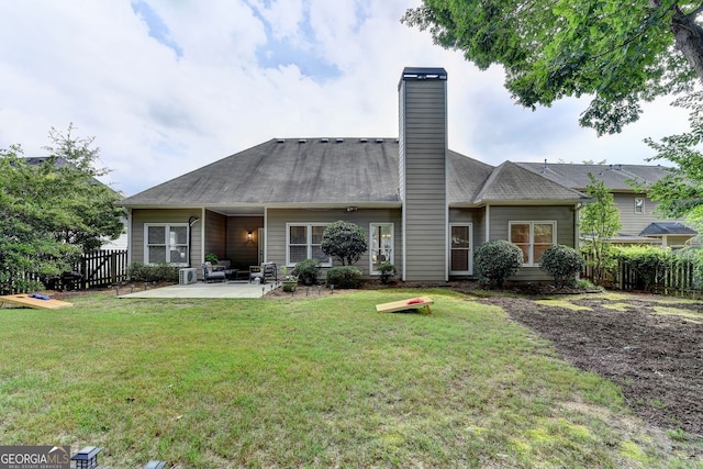 1635 Lake Heights Cir, Dacula, GA 30019 - rear view of house with a patio and a chimney