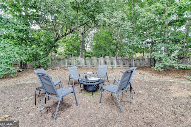 1635 Lake Heights Cir, Dacula, GA 30019 - fenced backyard with an outdoor fire pit