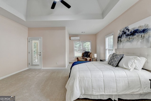 1635 Lake Heights Cir, Dacula, GA 30019 - bedroom featuring an AC wall unit, carpet floors, a raised ceiling, and a ceiling fan
