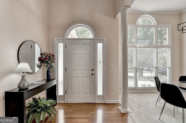 1635 Lake Heights Cir, Dacula, GA 30019 - entrance foyer with decorative columns, hardwood / wood-style flooring, and ornamental molding