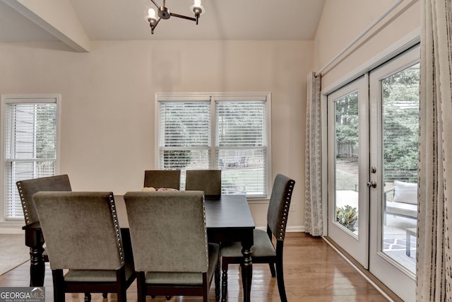 1635 Lake Heights Cir, Dacula, GA 30019 - dining space featuring a chandelier, french doors, and wood finished floors