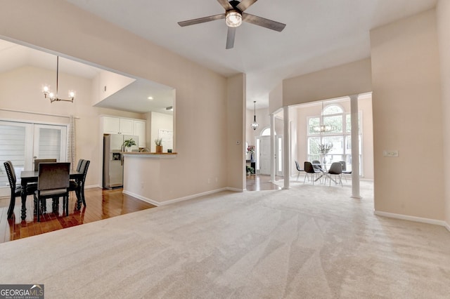 1635 Lake Heights Cir, Dacula, GA 30019 - dining area featuring a chandelier, ceiling fan, and light carpet