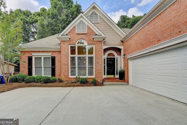 1635 Lake Heights Cir, Dacula, GA 30019 - traditional home featuring brick siding, concrete driveway, and roof with shingles