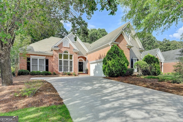 1635 Lake Heights Cir, Dacula, GA 30019 - traditional home featuring driveway, brick siding, a garage, and a shingled roof