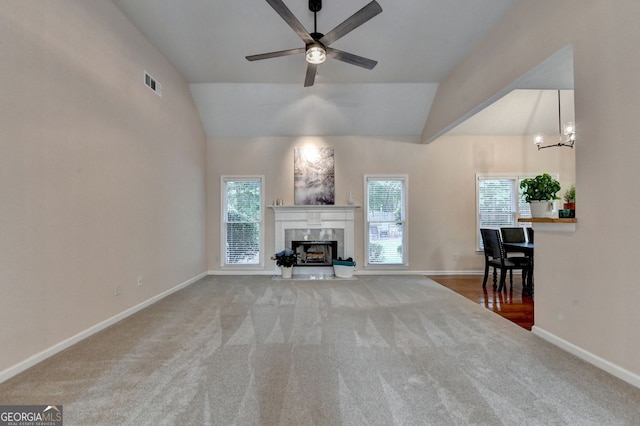 1635 Lake Heights Cir, Dacula, GA 30019 - living area with carpet flooring, ceiling fan, a premium fireplace, healthy amount of natural light, and lofted ceiling
