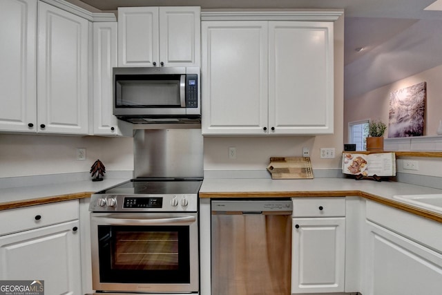 1635 Lake Heights Cir, Dacula, GA 30019 - kitchen featuring appliances with stainless steel finishes, white cabinets, and light countertops