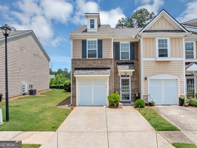 1936 Lakeshore Overlook Cir NW, Kennesaw, GA 30152 - view of front of property with a front lawn, concrete driveway, brick siding, and board and batten siding