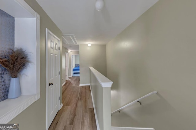 1936 Lakeshore Overlook Cir NW, Kennesaw, GA 30152 - hallway featuring an upstairs landing, wood finished floors, and attic access