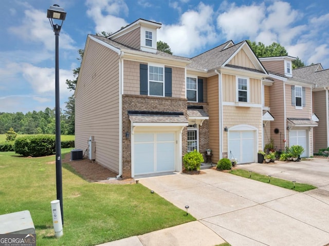 1936 Lakeshore Overlook Cir NW, Kennesaw, GA 30152 - multi unit property featuring concrete driveway, a front lawn, an attached garage, board and batten siding, and roof with shingles