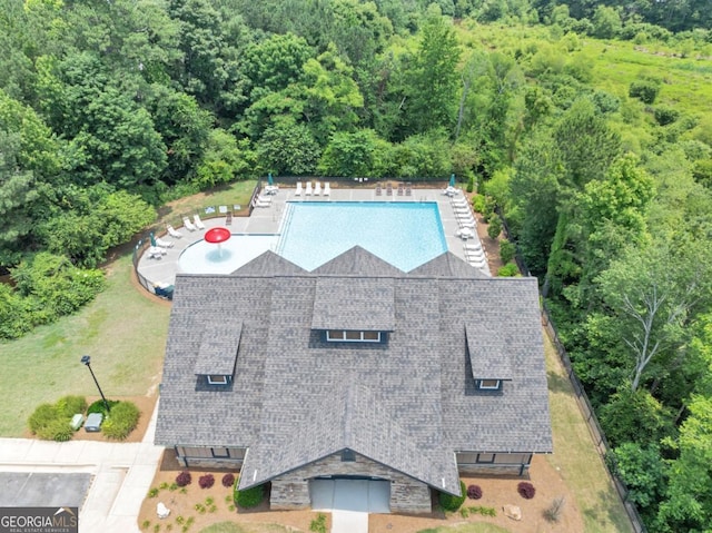 1936 Lakeshore Overlook Cir NW, Kennesaw, GA 30152 - aerial view of property and surrounding area featuring a pool area and a heavily wooded area