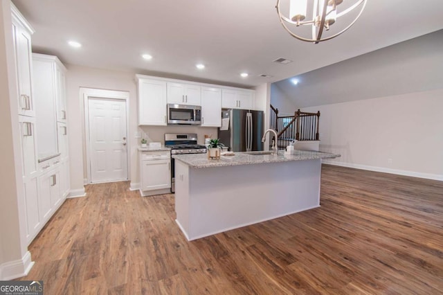 909 Shiloh Ridge Run NW, Kennesaw, GA 30144 - kitchen with appliances with stainless steel finishes, wood finished floors, white cabinets, and recessed lighting