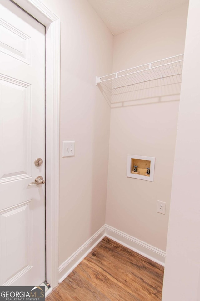 909 Shiloh Ridge Run NW, Kennesaw, GA 30144 - washroom with washer hookup and wood finished floors