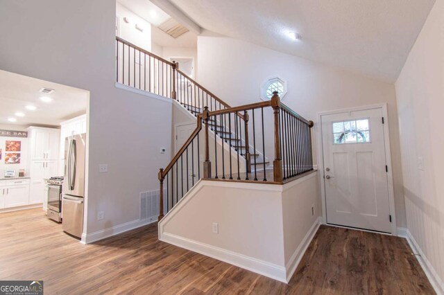 909 Shiloh Ridge Run NW, Kennesaw, GA 30144 - foyer entrance featuring high vaulted ceiling, light wood-style flooring, and stairs