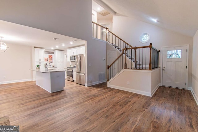 909 Shiloh Ridge Run NW, Kennesaw, GA 30144 - foyer entrance featuring high vaulted ceiling, wood finished floors, stairway, recessed lighting, and beamed ceiling