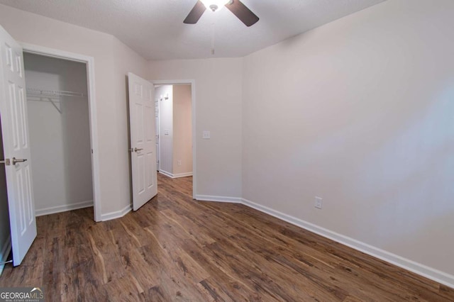 909 Shiloh Ridge Run NW, Kennesaw, GA 30144 - unfurnished bedroom with wood finished floors, a closet, and a ceiling fan