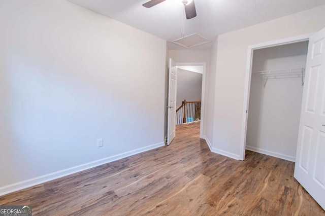 909 Shiloh Ridge Run NW, Kennesaw, GA 30144 - unfurnished bedroom featuring wood finished floors, a closet, and a ceiling fan