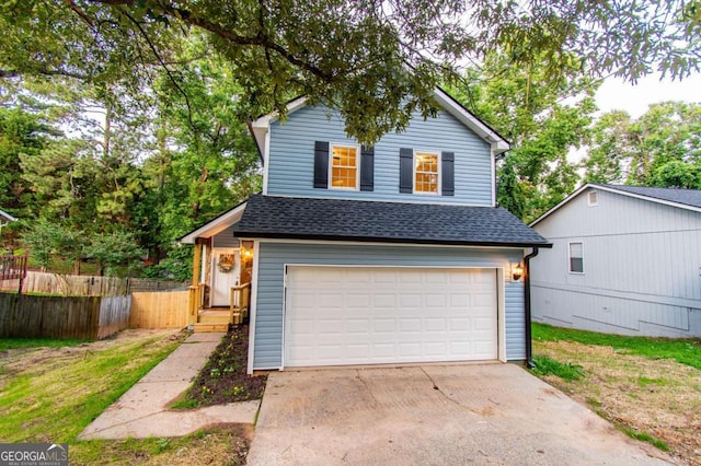 909 Shiloh Ridge Run NW, Kennesaw, GA 30144 - view of front of house featuring roof with shingles, a garage, and driveway