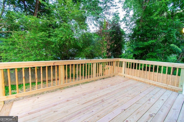 909 Shiloh Ridge Run NW, Kennesaw, GA 30144 - wooden deck featuring view of wooded area and a fenced backyard