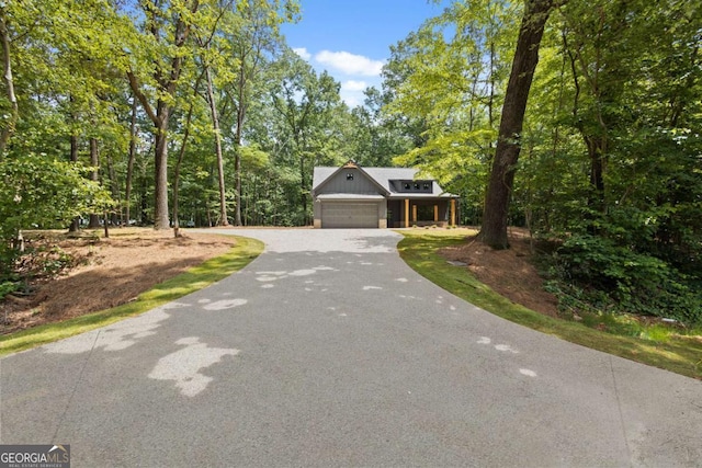 1687 Harmony Rd, Temple, GA 30179 - view of front of house featuring driveway and a garage