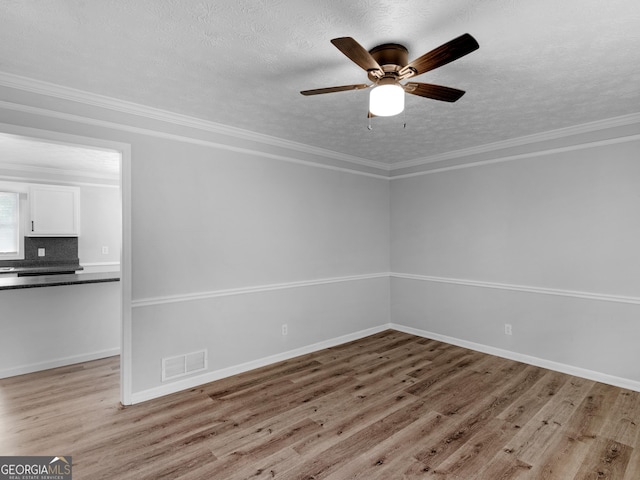 4720 Hull Rd SE, Conyers, GA 30094 - unfurnished room with light wood-style flooring, a textured ceiling, and a ceiling fan