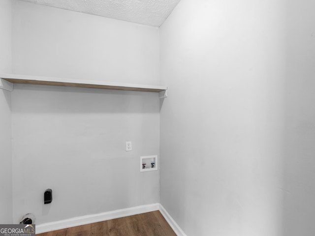 4720 Hull Rd SE, Conyers, GA 30094 - washroom featuring hookup for a washing machine, dark wood finished floors, and a textured ceiling
