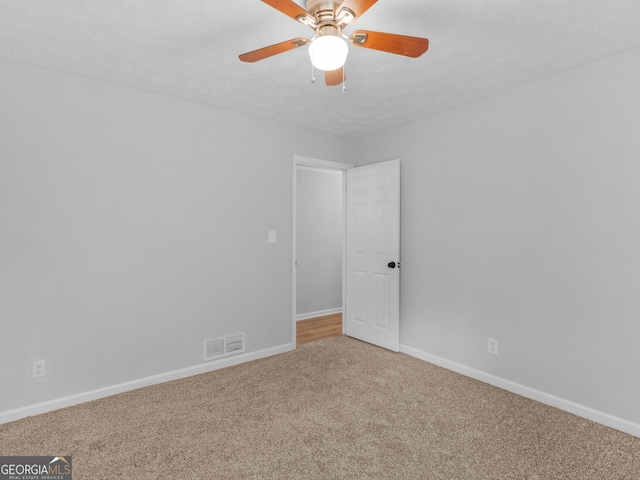 4720 Hull Rd SE, Conyers, GA 30094 - empty room with carpet flooring and a ceiling fan