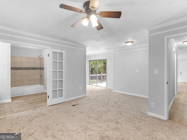 4720 Hull Rd SE, Conyers, GA 30094 - spare room featuring carpet floors, a textured ceiling, ceiling fan, and crown molding