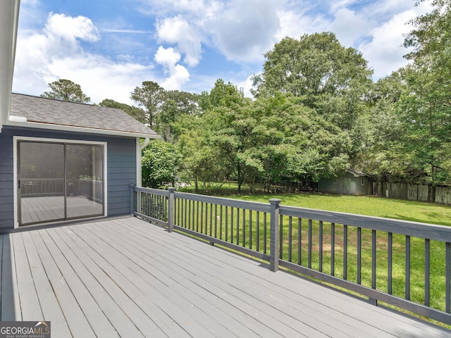 4720 Hull Rd SE, Conyers, GA 30094 - wooden deck with a storage shed and view of wooded area