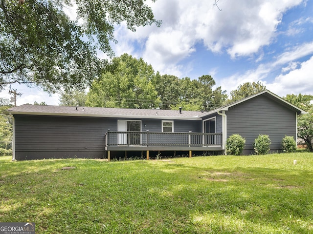 4720 Hull Rd SE, Conyers, GA 30094 - back of property featuring a wooden deck and a yard