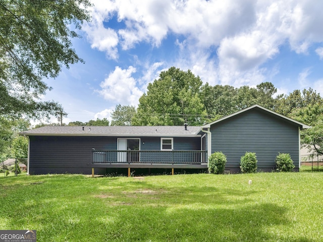 4720 Hull Rd SE, Conyers, GA 30094 - back of property featuring a wooden deck and a yard