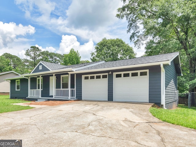 4720 Hull Rd SE, Conyers, GA 30094 - single story home with covered porch, an attached garage, driveway, and roof with shingles