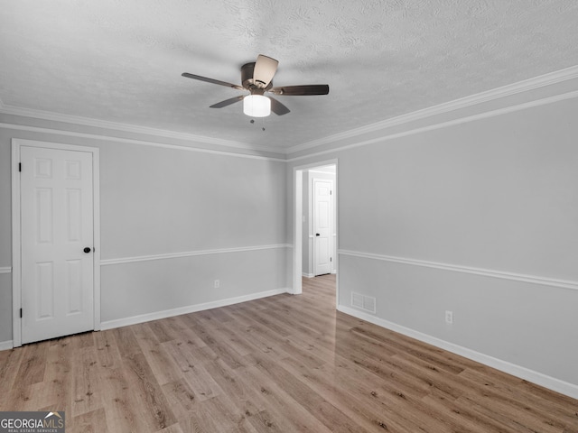 4720 Hull Rd SE, Conyers, GA 30094 - spare room with wood finished floors, ceiling fan, a textured ceiling, and ornamental molding