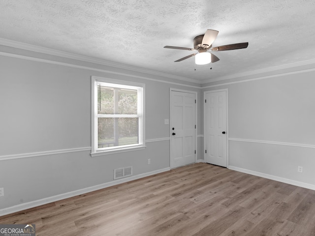 4720 Hull Rd SE, Conyers, GA 30094 - spare room featuring wood finished floors, a textured ceiling, ceiling fan, and crown molding