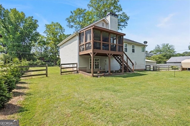 47 Powder Springs St, Hiram, GA 30141 - rear view of property featuring a sunroom, a chimney, and stairs