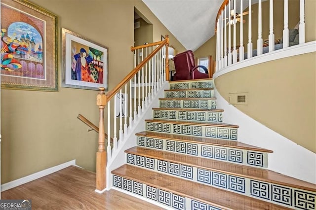 47 Powder Springs St, Hiram, GA 30141 - stairs with wood finished floors and high vaulted ceiling